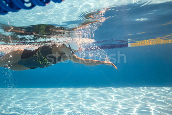 Woman swims underwater Stock photo © bezikus