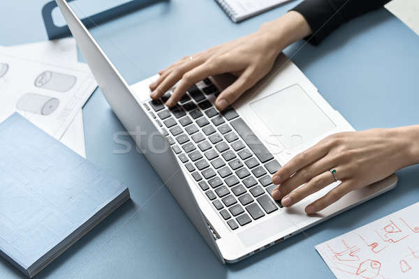Lány laptopot használ iroda női kezek laptop Stock fotó © bezikus
