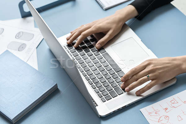 Girl using laptop in office Stock photo © bezikus