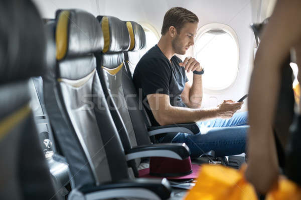 Gut aussehend guy Flugzeug cute Mann Fenster Stock foto © bezikus