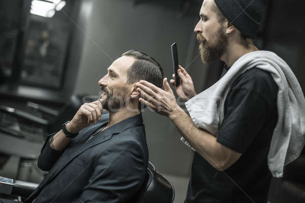 Making hairstyle in barbershop Stock photo © bezikus