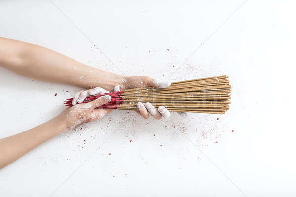 Aroma sticks in hands in powder Stock photo © bezikus