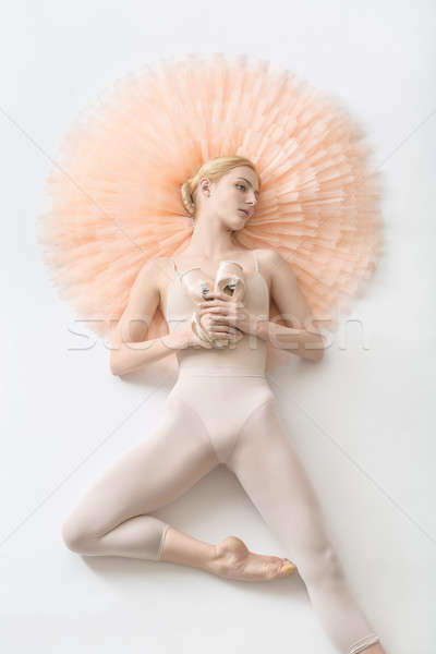 Blonde ballerina lies in studio Stock photo © bezikus