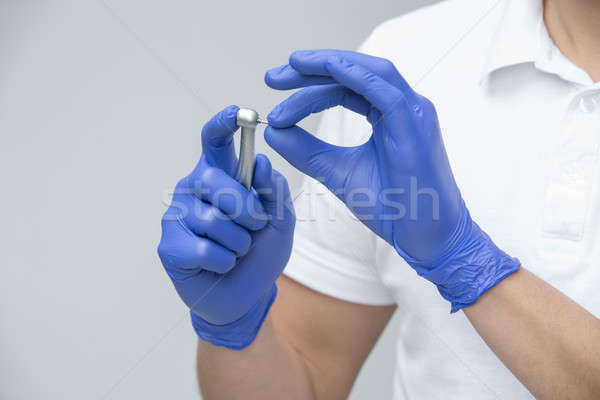 Fogászati fogorvos kék gumikesztyű fehér póló Stock fotó © bezikus