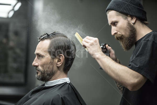 Barber is using spray bottle  Stock photo © bezikus
