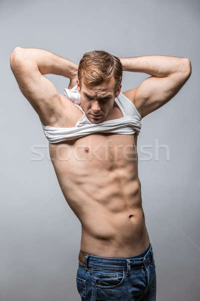 Muscular man in studio  Stock photo © bezikus