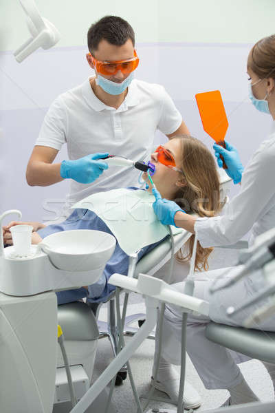 девушки лечение зубов Cute синий рубашку пациент Сток-фото © bezikus