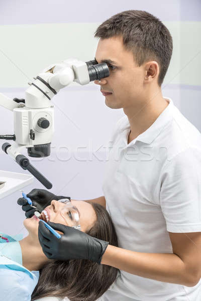 Dentist with patient in clinic Stock photo © bezikus
