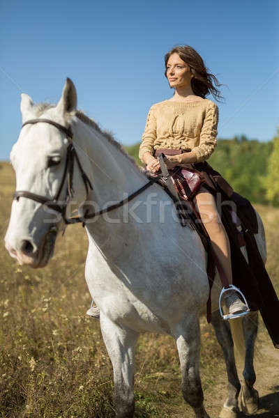 Stock fotó: Gyönyörű · lány · lovaglás · fehér · ló · mező · profil · kamerába