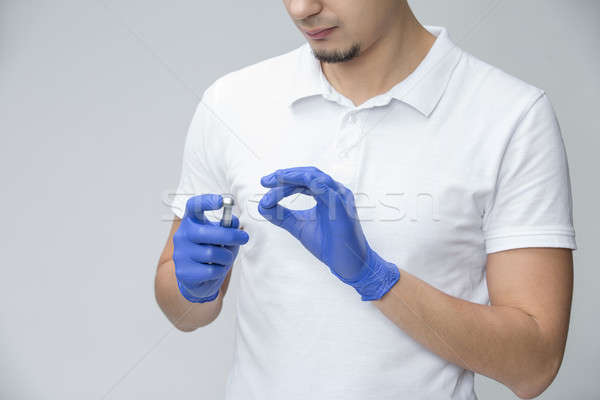 Fogorvos fogászati férfi orvos kék gumikesztyű fehér Stock fotó © bezikus