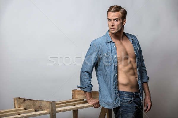 Man in unbuttoned shirt Stock photo © bezikus