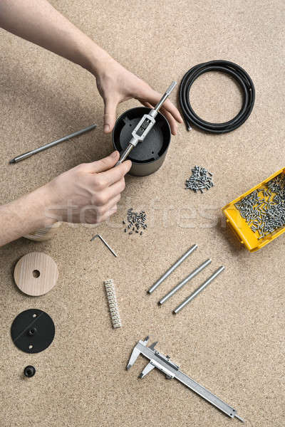 Guy using wrench in workshop Stock photo © bezikus