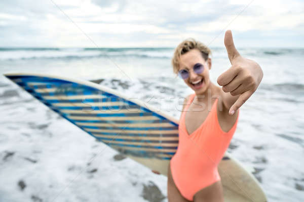 Girl with surfboard on beach Stock photo © bezikus