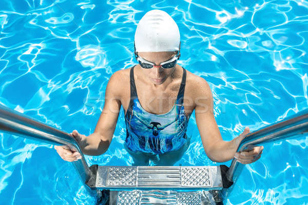 Athletic girl in the swim pool Stock photo © bezikus