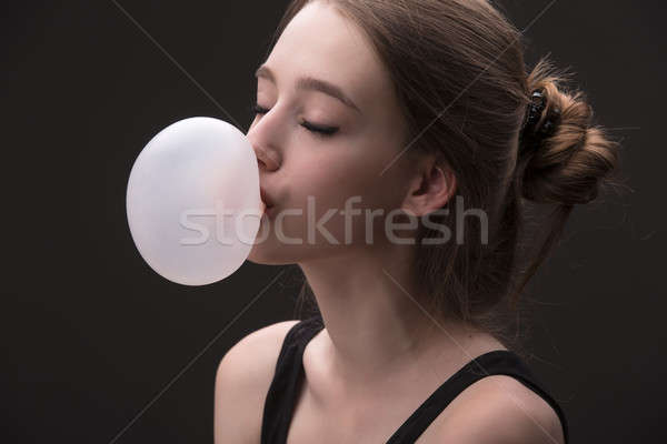 Sexual brown-haired girl with bubble of chewing gum Stock photo © bezikus