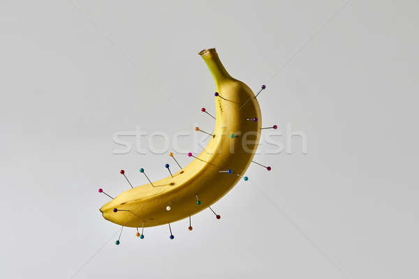 Banana with colorful pins Stock photo © bezikus