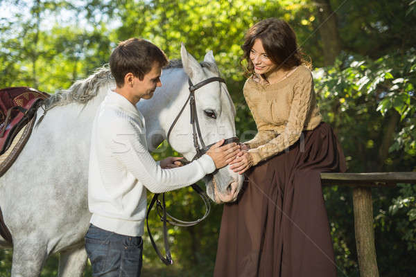 Young couple riding Stock photo © bezikus