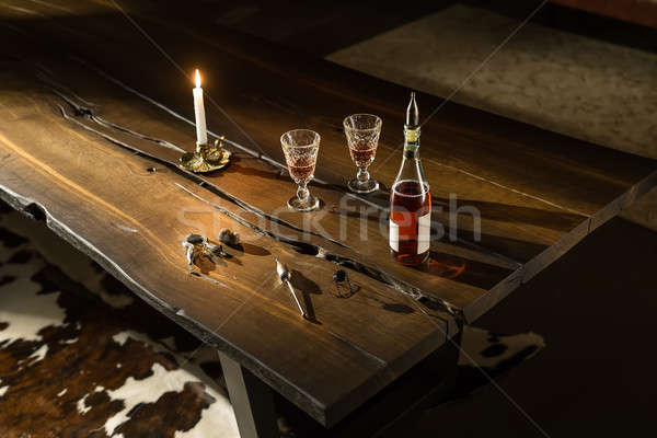 Bottle with glasses and accessories on table Stock photo © bezikus