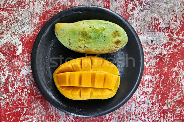 Colorful mangoes on plate Stock photo © bezikus