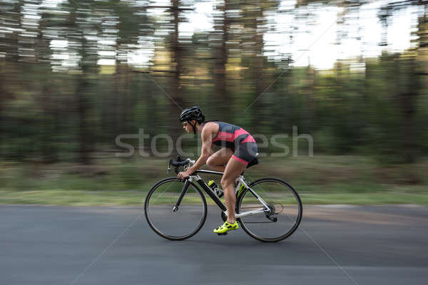 Menina bicicleta enérgico estrada natureza Foto stock © bezikus