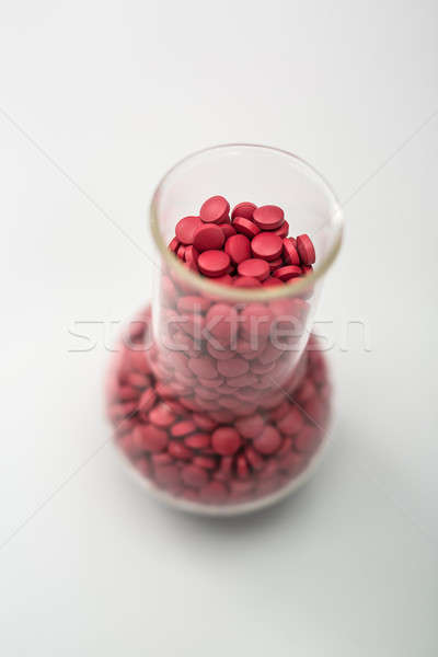 Kolben rot Pillen Glas viele Placebo Stock foto © bezikus
