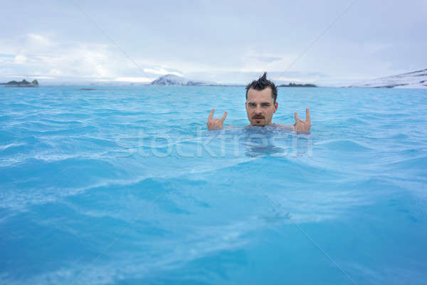 Guy relaxing in geothermal pool outdoors Stock photo © bezikus