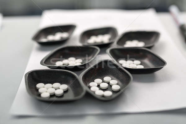 Small bowls with pills Stock photo © bezikus