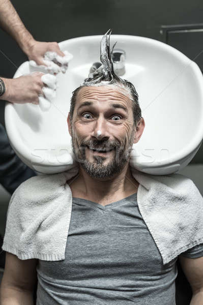 Stylish man in barbershop Stock photo © bezikus