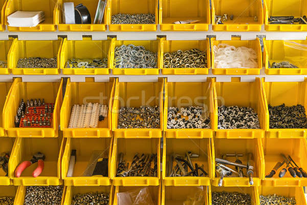 Plastic yellow boxes with instruments on wall Stock photo © bezikus