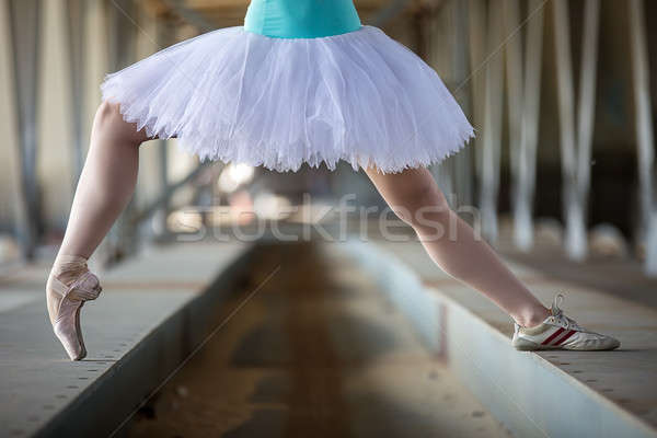 Stock photo: Cropped picture legs of graceful ballerina in white tutu