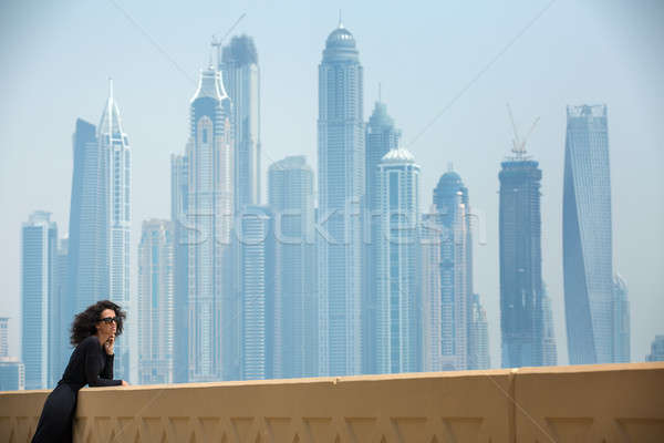 Woman on the background of skyscrapers Stock photo © bezikus