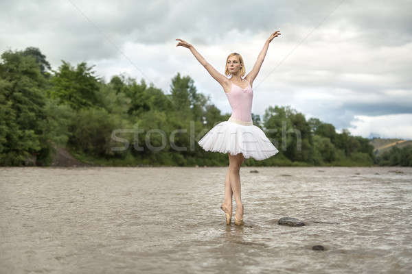 Ballerina posing in river Stock photo © bezikus