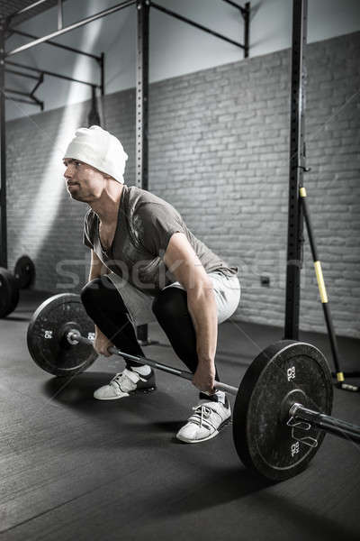 Man's crossfit workout with barbell Stock photo © bezikus