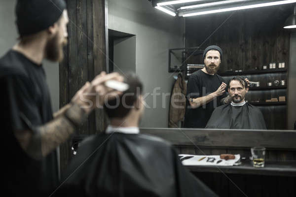 Stylish man in barbershop Stock photo © bezikus