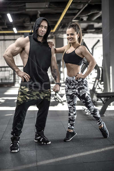 Sportive couple in gym Stock photo © bezikus