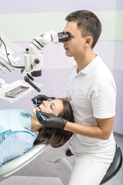 Dentist with patient in clinic Stock photo © bezikus