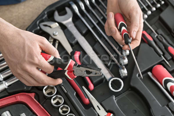 Open toolbox and male hands Stock photo © bezikus