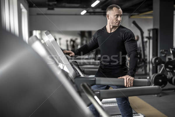 Mighty man on treadmill Stock photo © bezikus