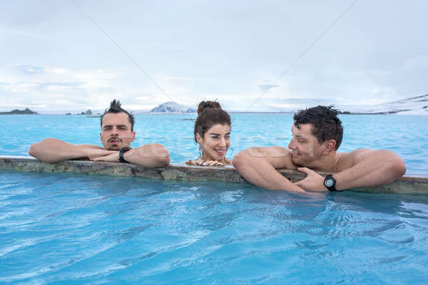 People relaxing in geothermal pool outdoors Stock photo © bezikus