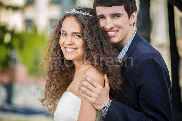 Portrait of happy wedding couple outdoors Stock photo © bezikus