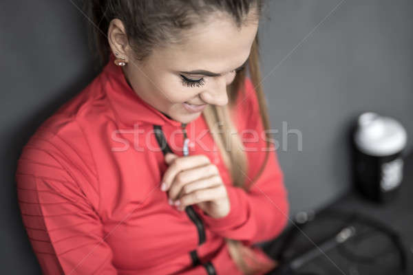 Sportive girl relaxing in gym Stock photo © bezikus