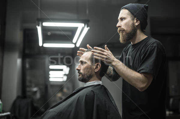 Making hairstyle in barbershop Stock photo © bezikus