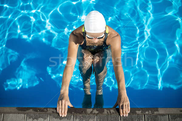 Athletic girl in the swim pool Stock photo © bezikus