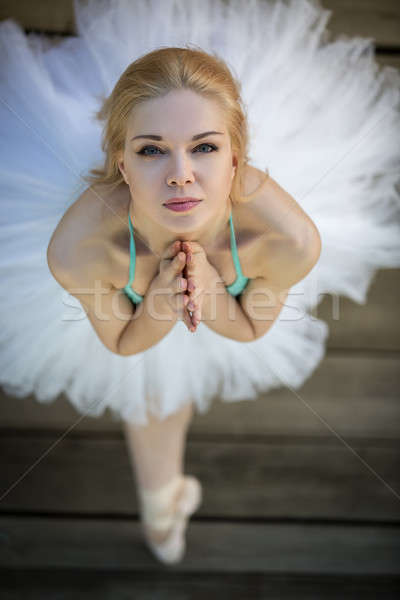Close portrait of a cute ballerina in white tutu and blue bathin Stock photo © bezikus
