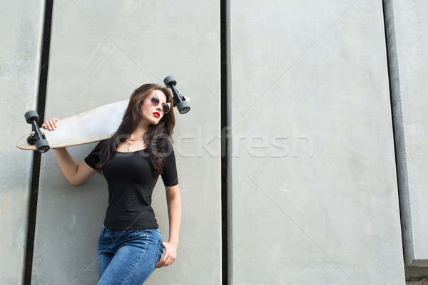 Girl with long boards Stock photo © bezikus