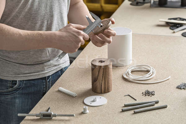 Man using caliper in workshop Stock photo © bezikus