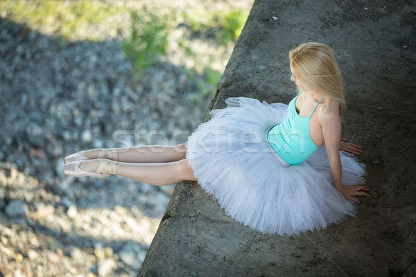 Ballerina sitting on the edge of bridge Stock photo © bezikus