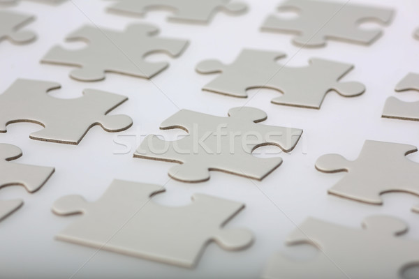 Stock photo: Neatly Aligned Jigsaw Puzzle Pieces