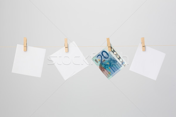 Three White Notes and a Twenty Euro Banknote Stock photo © bigandt