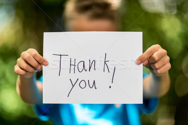 Fiú köszönjük felirat elmosódott tart darab Stock fotó © bigandt